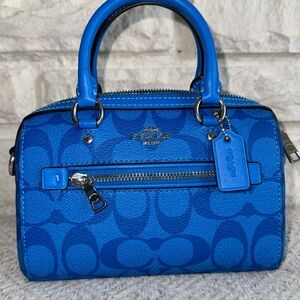 Coach mini purse. Bright blue with classic C pattern design.